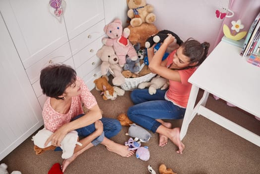 Bedroom, relax and mother with girl on floor at home for childhood development, bonding and love. Mom, kid and teddy bear on ground with connection, support and care in motherhood from above.