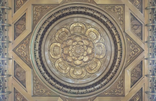 Bangkok, Thailand - Apr 11, 2024 - Decorative sculptures on ceiling interior the Buddhism church of Fo Guang Shan Thaihua Temple is famous place. Taiwanese temple style, Space for text, Selective focus.