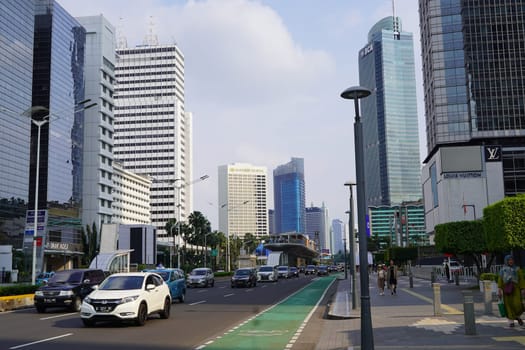 Aprilm11, 2024. Jakarta, Indonesia. The atmosphere of the city around the HI Roundabout and the big and iconic bus shelter. one day after Eid al-Fitr 2024