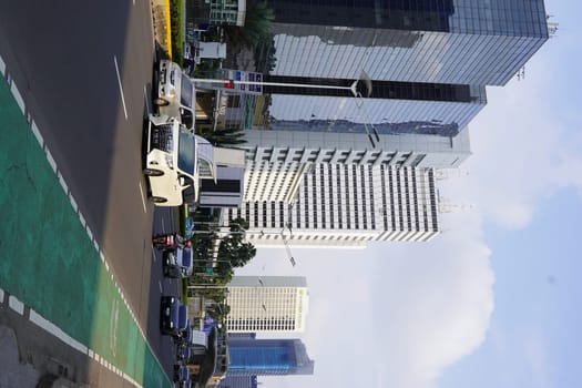 Aprilm11, 2024. Jakarta, Indonesia. The atmosphere of the city around the HI Roundabout and the big and iconic bus shelter. one day after Eid al-Fitr 2024