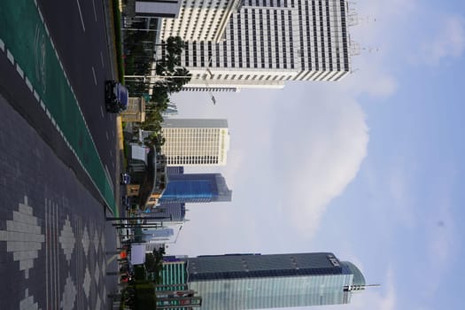 Aprilm11, 2024. Jakarta, Indonesia. The atmosphere of the city around the HI Roundabout and the big and iconic bus shelter. one day after Eid al-Fitr 2024