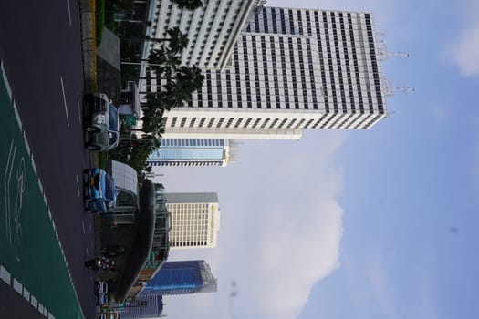 Aprilm11, 2024. Jakarta, Indonesia. The atmosphere of the city around the HI Roundabout and the big and iconic bus shelter. one day after Eid al-Fitr 2024