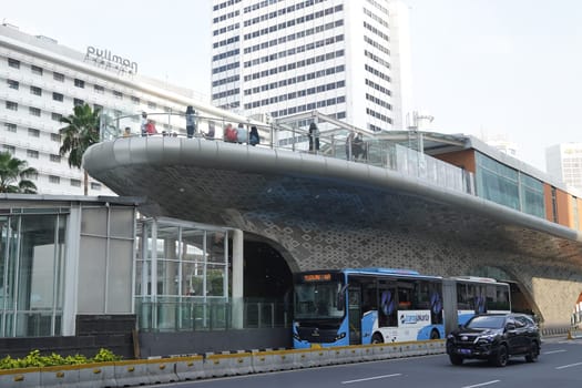 Aprilm11, 2024. Jakarta, Indonesia. The atmosphere of the city around the HI Roundabout and the big and iconic bus shelter. one day after Eid al-Fitr 2024