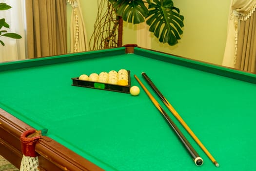 Billiard balls in a triangle and a cue on the table