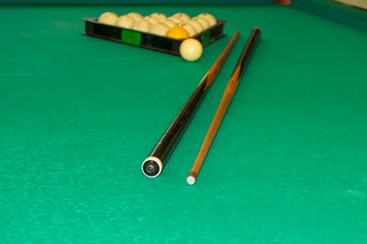 Billiard balls in a triangle and a cue on the table