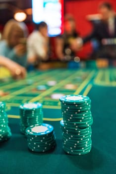 Poker chips on a poker table at the casino