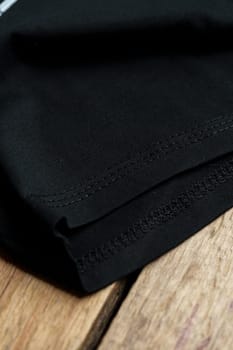 Black plain cotton t-shirt sleeve close up photo