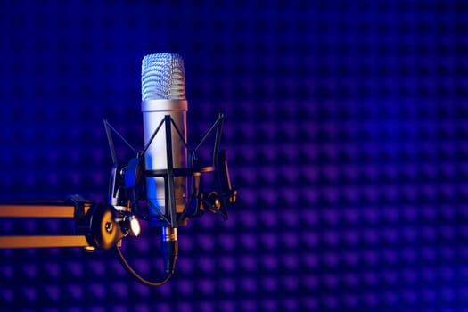 Close up photo of professional microphone in recording studio