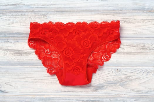 Top view women's underwear panties on a wooden background flat lay