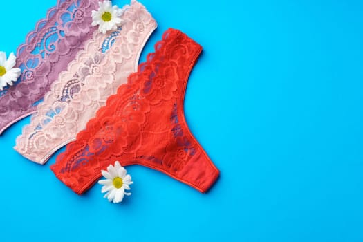 Women's panties with flower buds on paper background studio shot