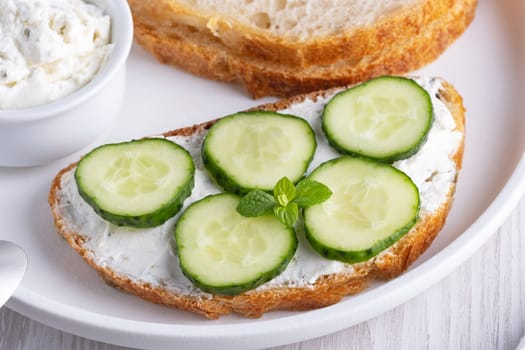 Olive bread with cottage cheese and cucumbers.