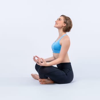 Full body length gaiety shot athletic and sporty woman doing healthy and meditative yoga exercise workout posture on isolated background. Healthy active and body care lifestyle