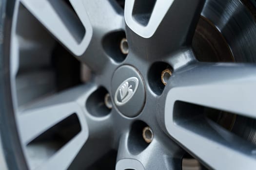 Bobruisk, Belarus - September 24, 2023: Automobile company logo - Lada on a car wheel.