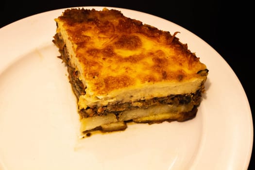 Indulge in the rich culinary tradition of the Mediterranean with this enticing plate of moussaka. Layers of tender eggplant, savory minced meat, and creamy bechamel sauce come together in a symphony of flavors and textures.