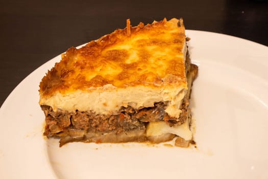 Indulge in the rich culinary tradition of the Mediterranean with this enticing plate of moussaka. Layers of tender eggplant, savory minced meat, and creamy bechamel sauce come together in a symphony of flavors and textures.