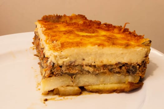 Indulge in the rich culinary tradition of the Mediterranean with this enticing plate of moussaka. Layers of tender eggplant, savory minced meat, and creamy bechamel sauce come together in a symphony of flavors and textures.