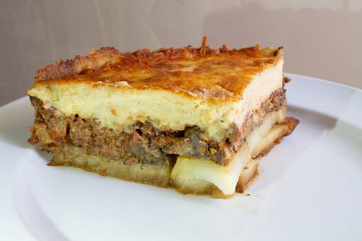 Indulge in the rich culinary tradition of the Mediterranean with this enticing plate of moussaka. Layers of tender eggplant, savory minced meat, and creamy bechamel sauce come together in a symphony of flavors and textures.