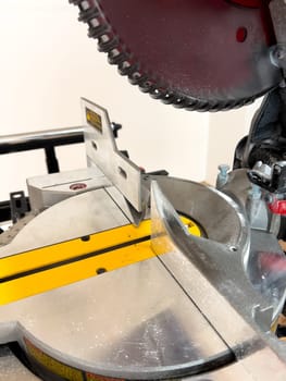 Get up close with the advanced features of a double bevel sliding miter saw, perfect for accurate and clean cuts in woodworking projects.