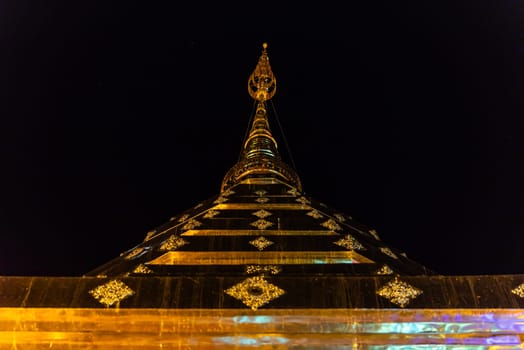 Chiang Mai, Thailand - January 8, 2022 : Wat Phra That Doi Suthep at night time is buddhist temple (wat) in Chiang Mai province. Within the site are pagodas, statues, bells, a museum, and shrines.