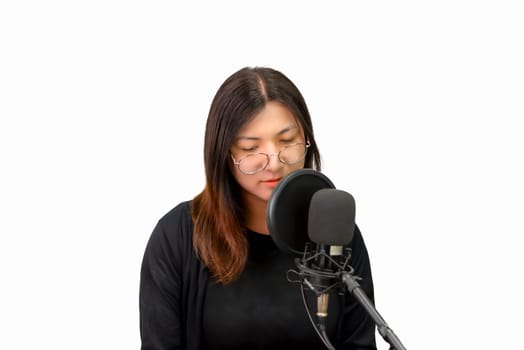 Beautiful asian woman (LGBTQ) is a singer. She enjoying sing a song or karaoke in music studio with microphone condenser and headphones for fun or voice creative