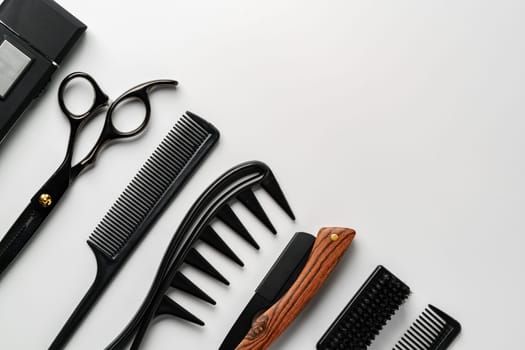 Set of barber tools for haircut on gray background flat lay studio shot