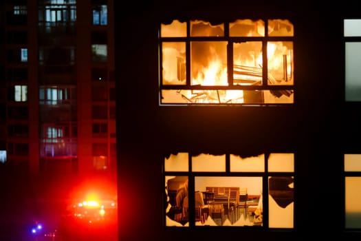 close-up of a raging fire in an apartment building.