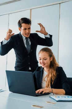 Businessman boss feels angry and mad at bad misbehaving businesswoman employee who ignores the work tasks at the workplace. Firing workers and human resources management problem concept. uds