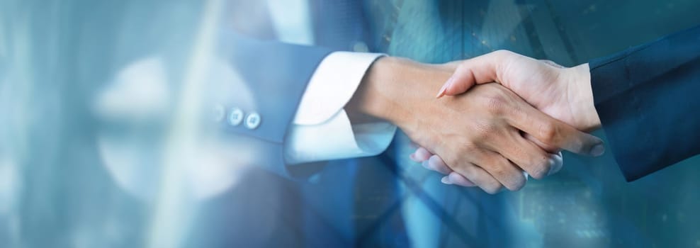 Business handshake with partnership, greeting, dealing, city business background, teamwork and successful business, connection communication of business.