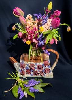 Romantic bouquet of the first garden flowers. The art of flower arranging