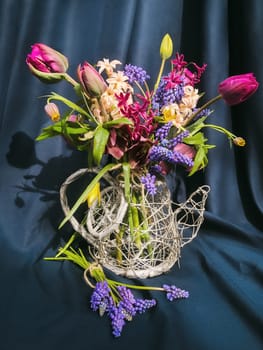 Romantic bouquet of the first garden flowers. The art of flower arranging