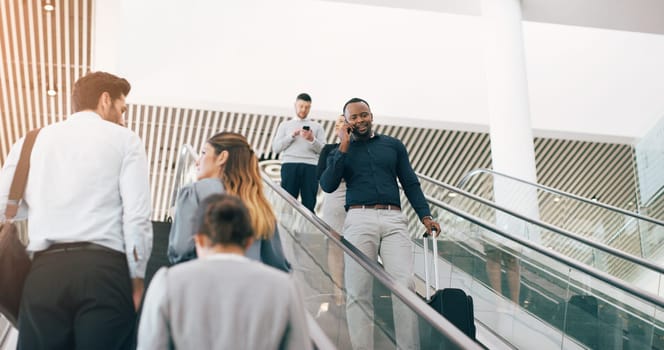 Businessman, escalator and talking with phone call for discussion or communication on work trip. Black man speaking on mobile smartphone in travel with luggage for immigration or new opportunity.