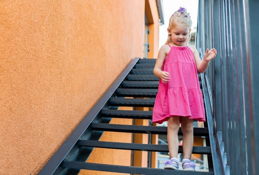 Child walks with cochlear implant system. Installation cochlear implant on child girl ear for restores hearing. Kid hears after hear return to normal. Diversity inclusion