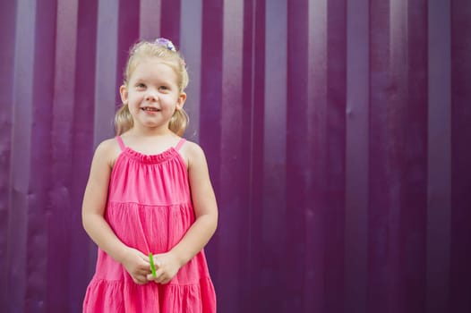 Child walks with cochlear implant system. Installation cochlear implant on child girl ear for restores hearing. Kid hears after hear return to normal. Diversity inclusion