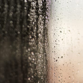 Glass, water or raindrops with steam on surface, texture and wallpaper or screensaver with abstract. Moisture, humid or liquid bubble on window, condensation and droplet with fog or reflection.