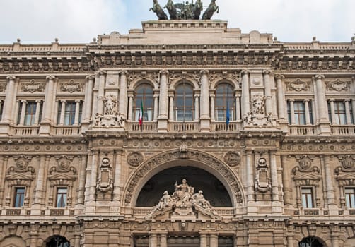Closeup detail showing ornate facade exterior of Palace of Justice building in rome Italy with statues