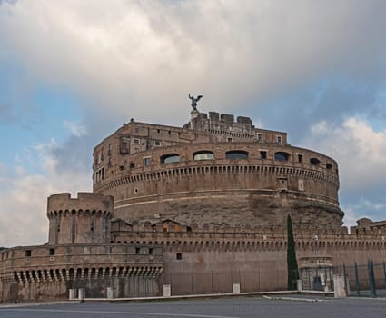 View showing old Roman castel Sant'Angelo exterior facade in Rome Italy European city with rotunda tower and turret