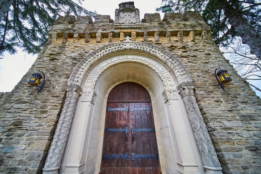 Bishop Simon Brute College majestic Gothic-style entrance, displaying resilience of faith and tradition under Indiana's overcast spring skies.