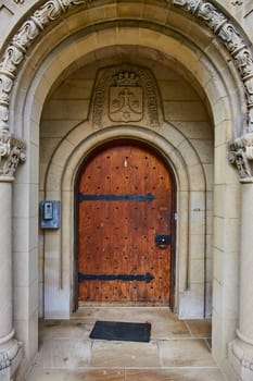 Vintage wooden door of Bishop Simon Brute College in Indianapolis, merging tradition with modernity in Spring setting.