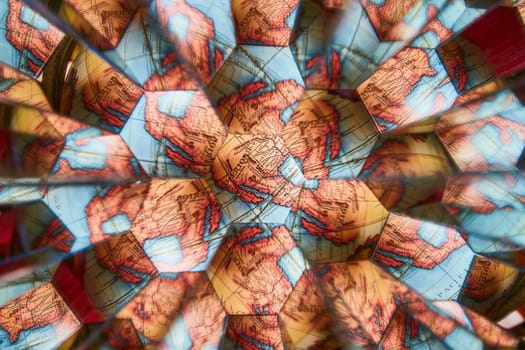 Kaleidoscopic World Map - Vivid abstract presentation of global geography in warm hues against cool blues, showcasing complexities of travel and diversity.