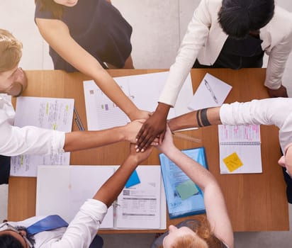 Business people, top view and hands with teamwork, stack and cooperation for development and support. NPO, meeting and group with documents and diversity with collaboration for project and growth.