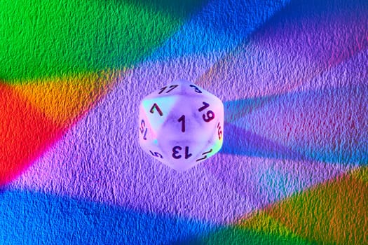 Gaming Success Unleashed, Macro Shot of D20 Dice on Vibrant Rainbow Background Captured in Fort Wayne, Indiana