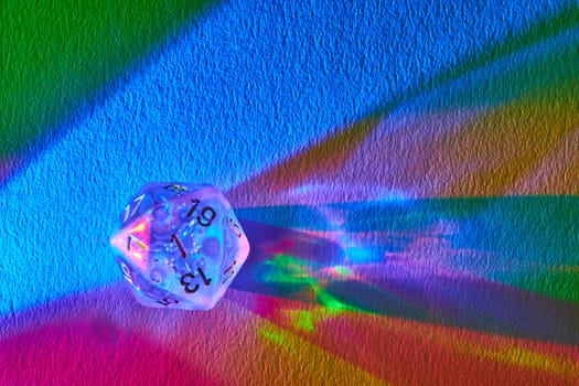 Prismatic D20 dice on a vibrant abstract canvas, reflecting the magic of tabletop gaming in Fort Wayne, Indiana