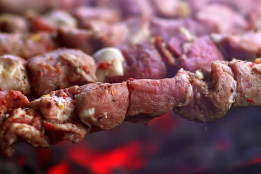 Cooking meat for outdoor barbecue. Close up pork meat barbecue on a charcoal grill. Cooking barbecue on charcoal.