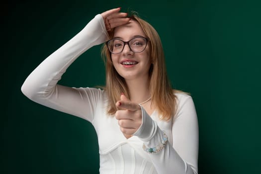 A woman wearing glasses and a white shirt is featured in this candid shot. She appears confident and focused as she goes about her day.