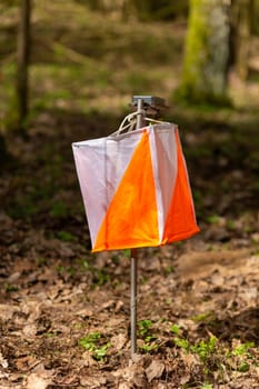 Orienteering. Control point Prism and electric composter for orienteering in the spring forest. Navigation equipment. The concept