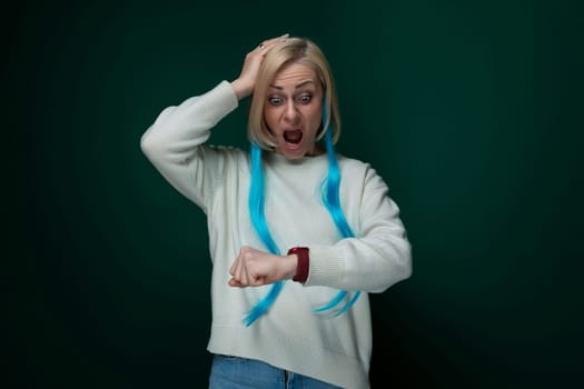 A woman with a surprised expression on her face, her eyes widened and mouth slightly agape. She appears shocked or startled by something unexpected.