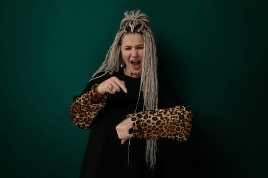 A woman with long flowing hair wearing a leopard print glove, showcasing a striking contrast between her natural beauty and the wild animal-inspired accessory. The womans graceful pose accentuates the elegance and fierceness of the leopard print glove.