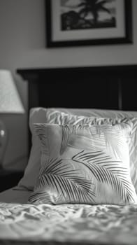 A bed with a pillow and two pictures on the wall