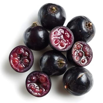 Creative arts meet natural produce with a bunch of magenta blackberries cut in half on a white background. These fruit are a fashionable accessory of the plant world