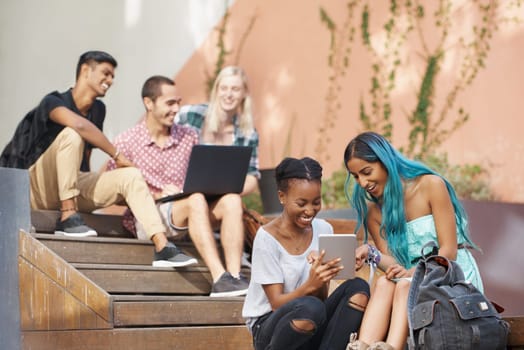 Tablet, education and students happy on university or college campus together for learning or study. People, smile or collaboration on school project for support, communication and diversity.